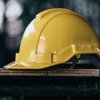 Yellow hard hat sitting on board